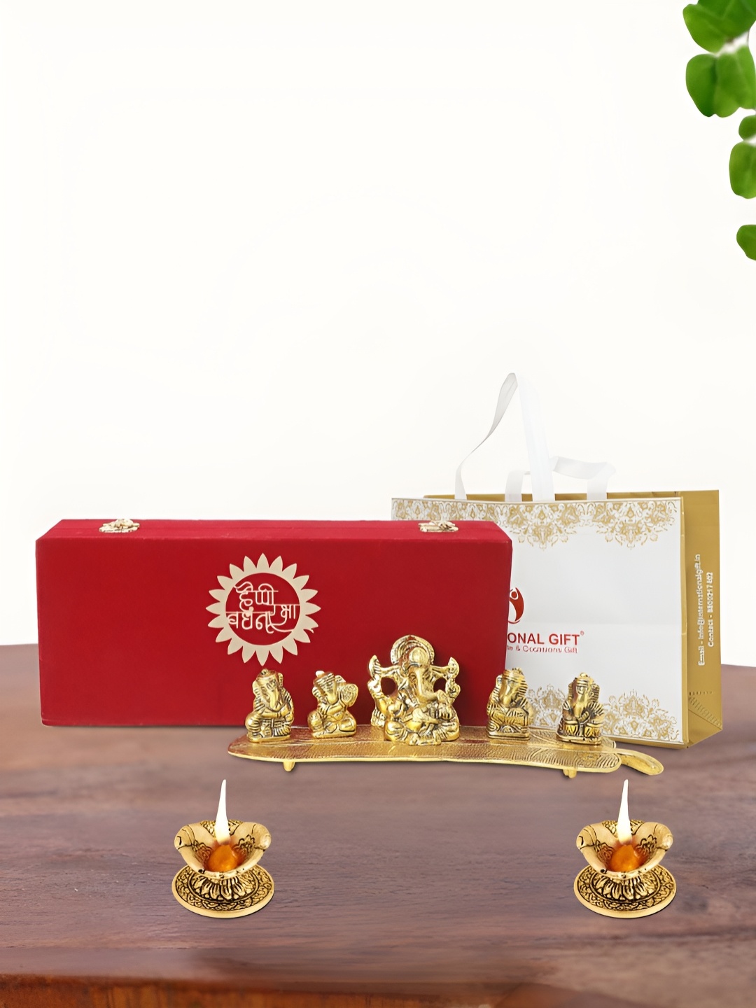 

INTERNATIONAL GIFT Gold Plated Musical Ganesh Idol with 2 Diya Box and Bag