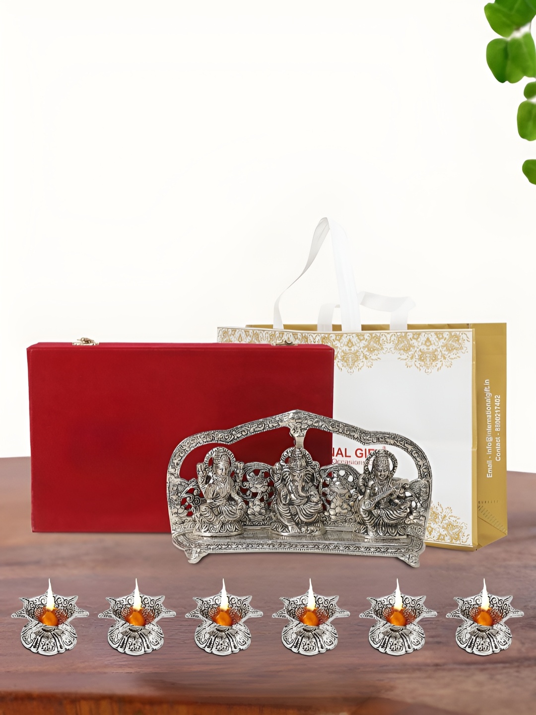 

INTERNATIONAL GIFT Silver Plated Laxmi Ganesh Saraswati Idol with 6 Diya and Box