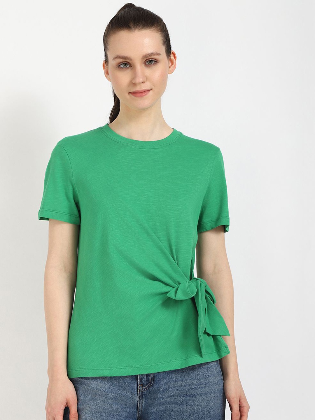 

Tommy Hilfiger Women Solid Round Neck Cotton T-shirt, Green