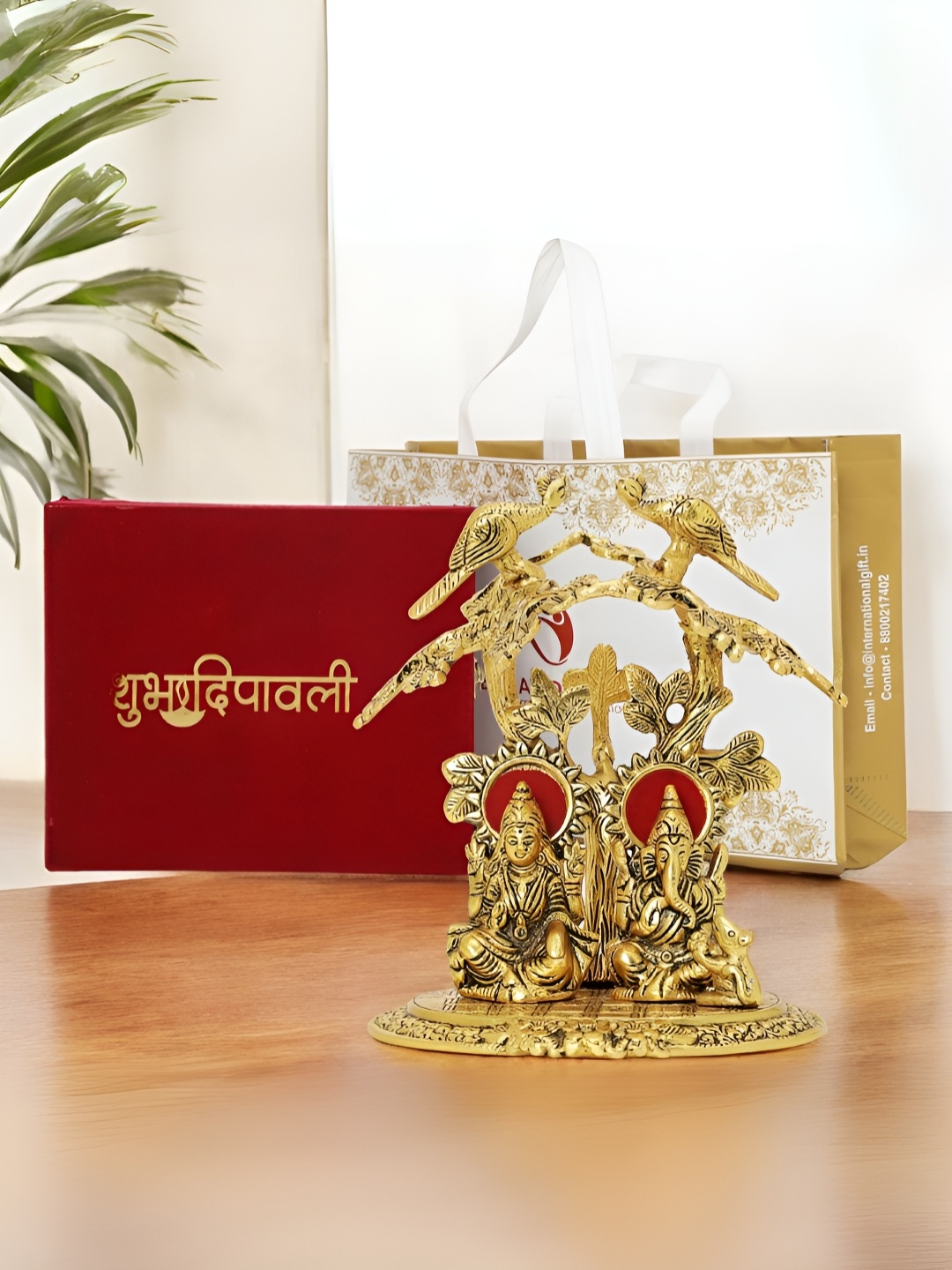 

INTERNATIONAL GIFT Gold Plated 3 Pcs Religious Showpiece With Diya Velvet Box & Carry Bag