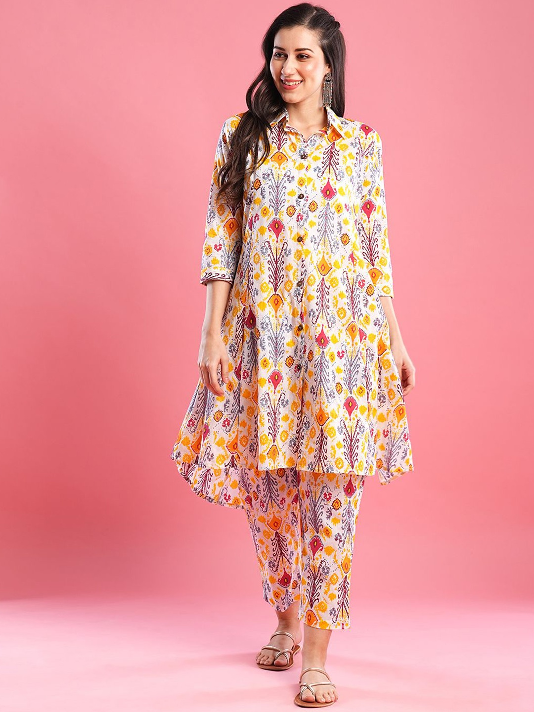 

Moda Rapido Yellow Ethnic Motifs Printed Shirt Collar Raw Silk A-Line Kurta With Trousers