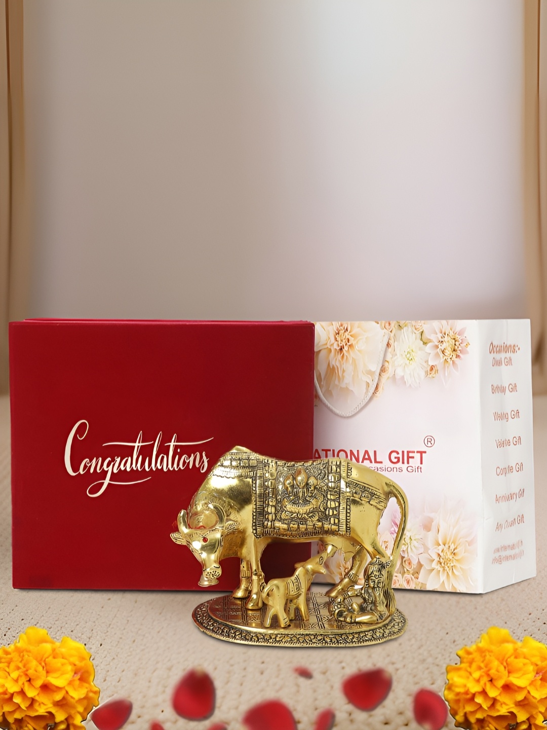 

INTERNATIONAL GIFT Gold-Toned Kamdhenu Cow Religious Idol Showpiece