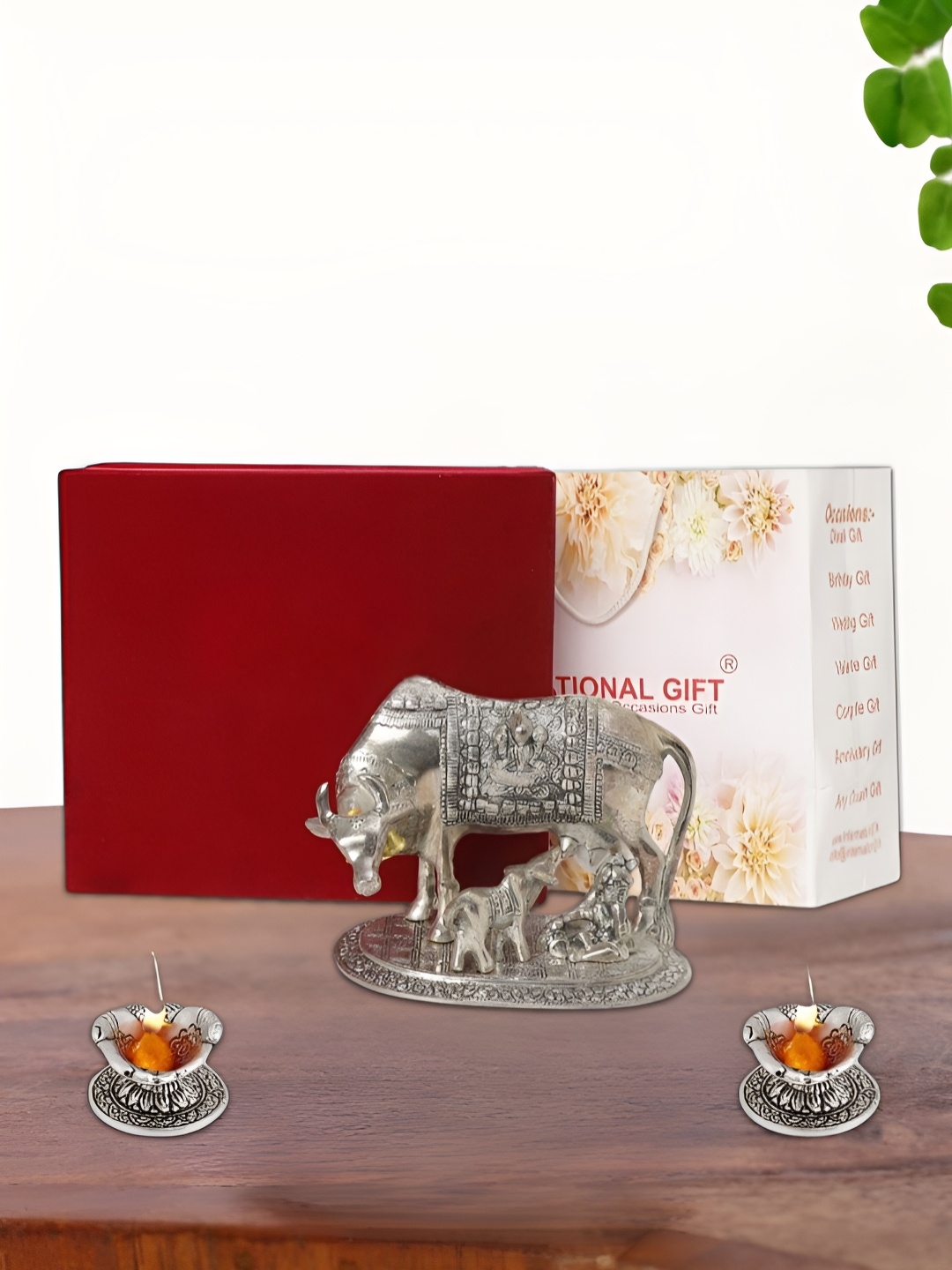 

INTERNATIONAL GIFT Silver Plated Kamdhenu Cow with 2 Diya Box and Bag