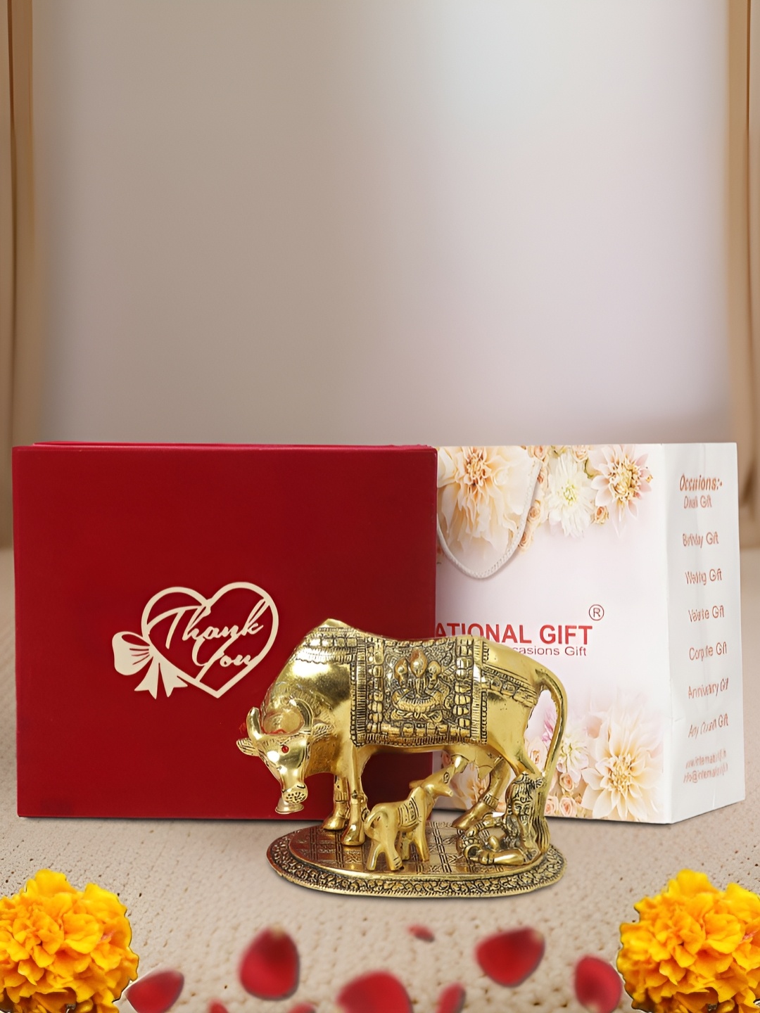 

INTERNATIONAL GIFT Gold-Toned Kamdhenu Cow Religious Idol Showpiece