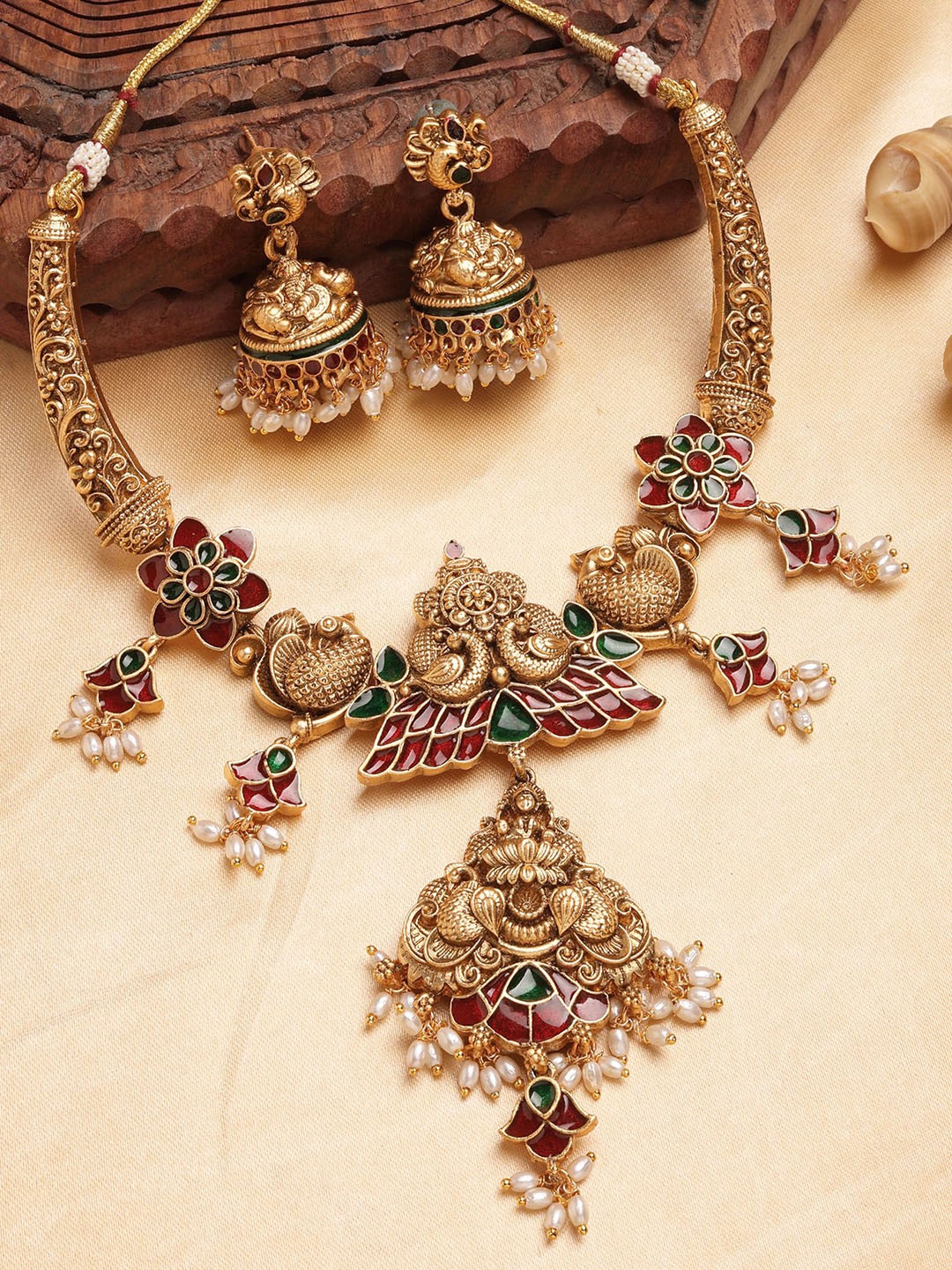 

KARATCART Gold Plated Stone Studded and Beaded Engraved Laxmi Mata & Peacock Jewellery Set