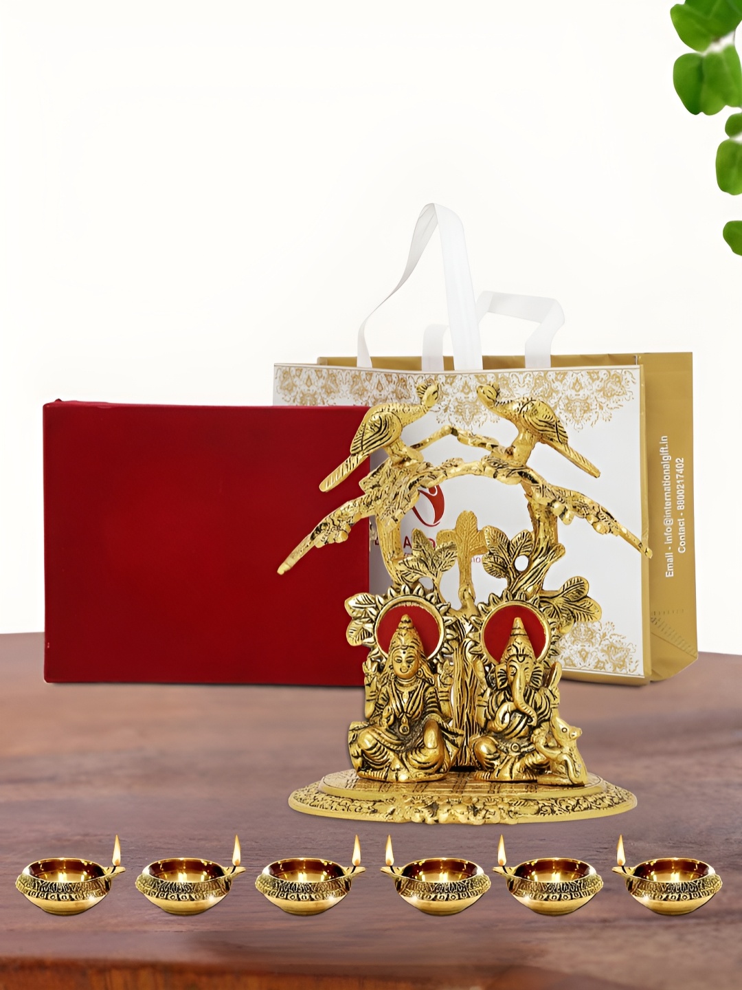 

INTERNATIONAL GIFT Gold Plated Laxmi Ganesh Idol with 6 Diya Box and Bag