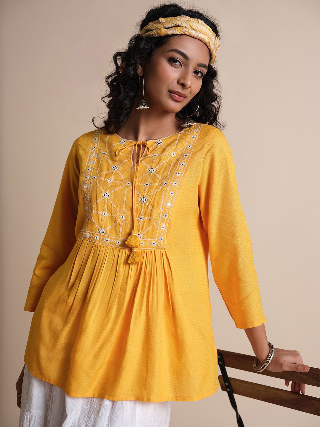 

Global Desi Women Embellished Tie-Up Neck Top, Mustard