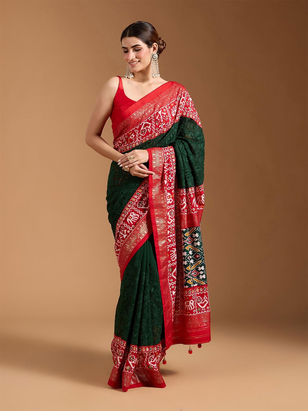 

Moda Rapido Ethnic Motifs Zari Pure Georgette Patola Saree, Green
