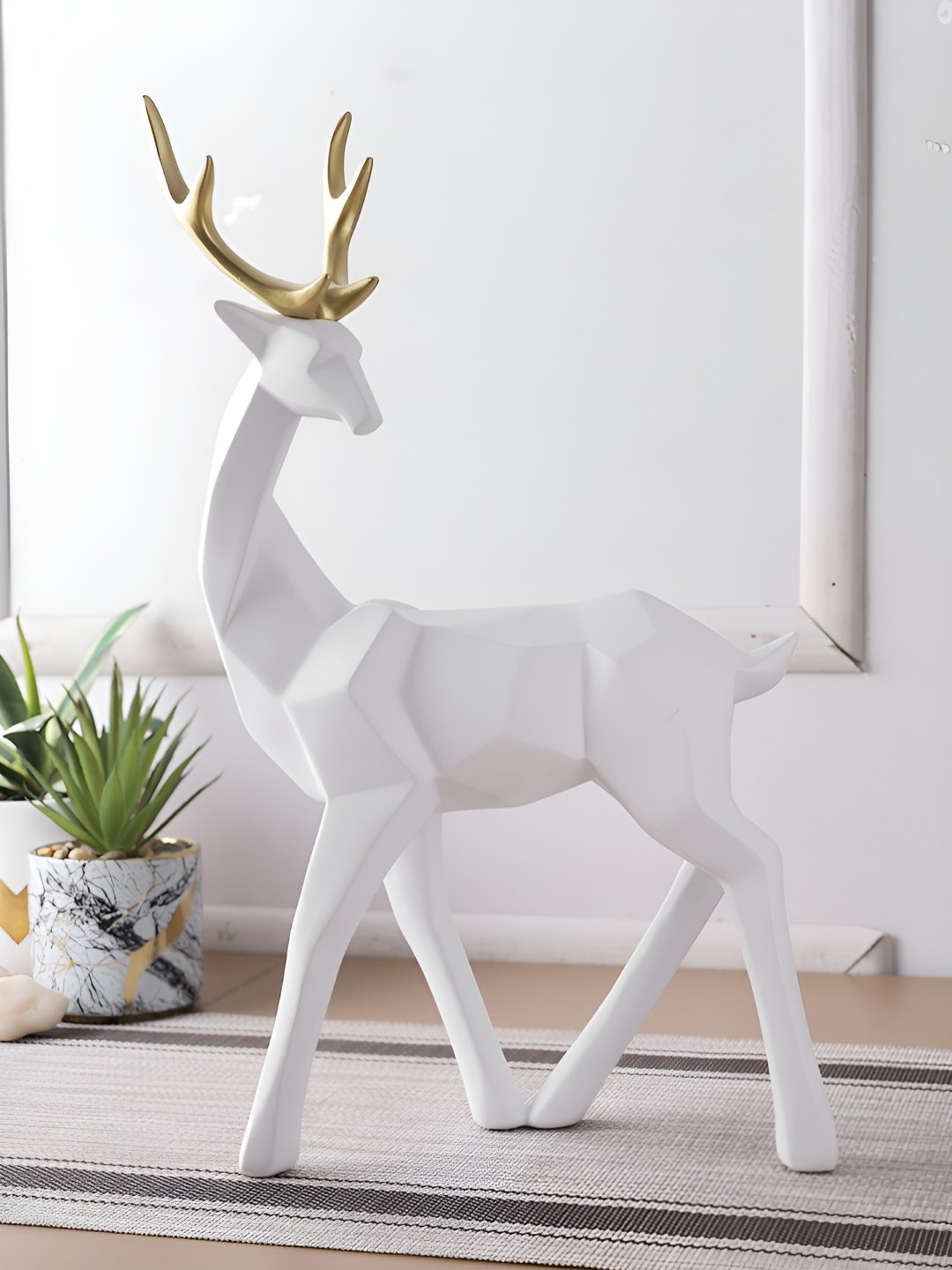 

Myntra Elegant Homes White Reindeer Figurine Showpiece