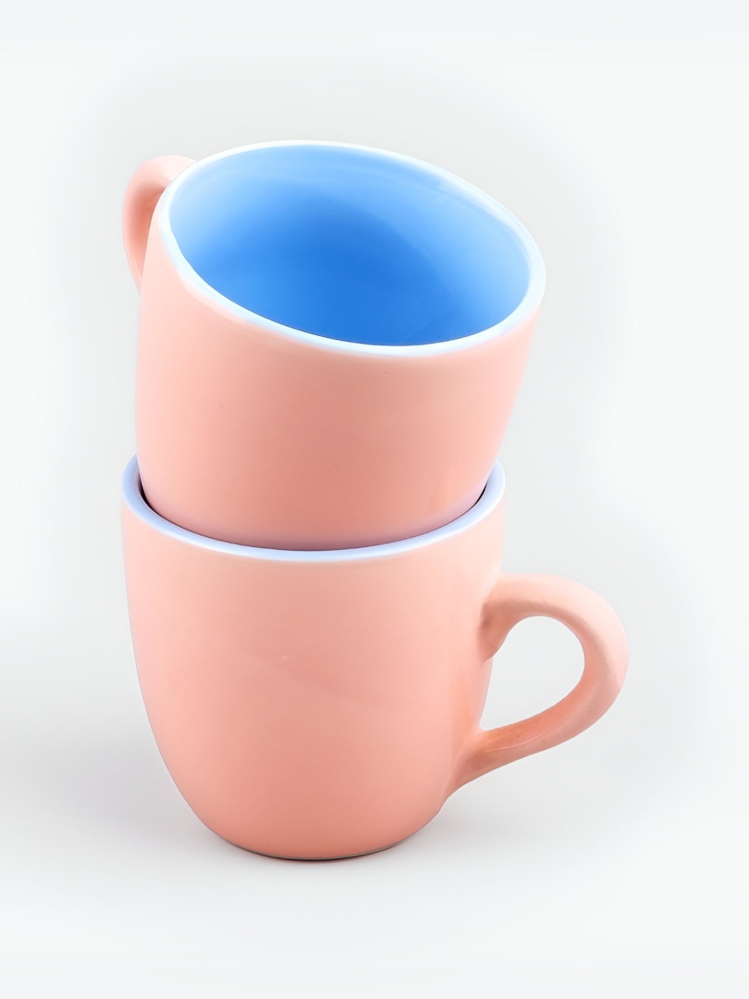 

Storepedia Peach-Coloured & Blue Solid Ceramic Glossy Cups Set of Cups and Mugs