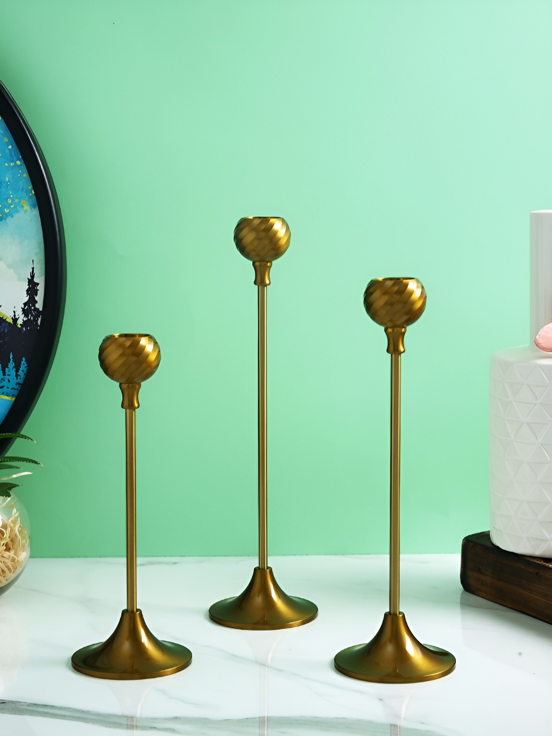 

Myntra Elegant Homes Gold-Toned 3 Pieces Metallic Candle Holder