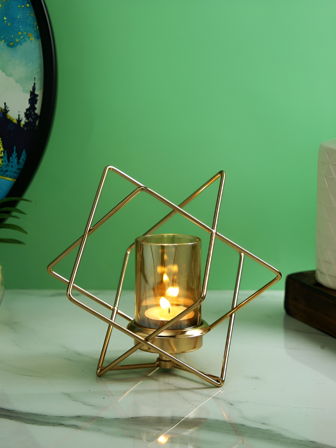 

Myntra Elegant Homes Gold-Toned Candle Holder