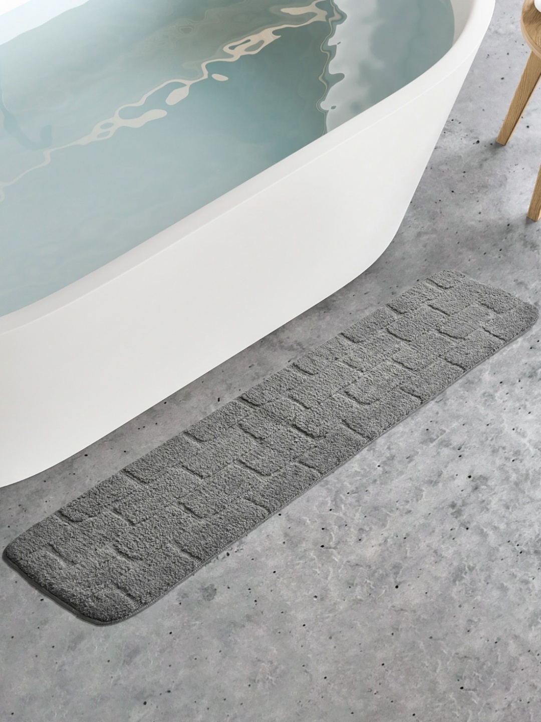 

Home Centre Buttercup Dots Grey Textured 150 GSM Anti-Slip Bath Rug