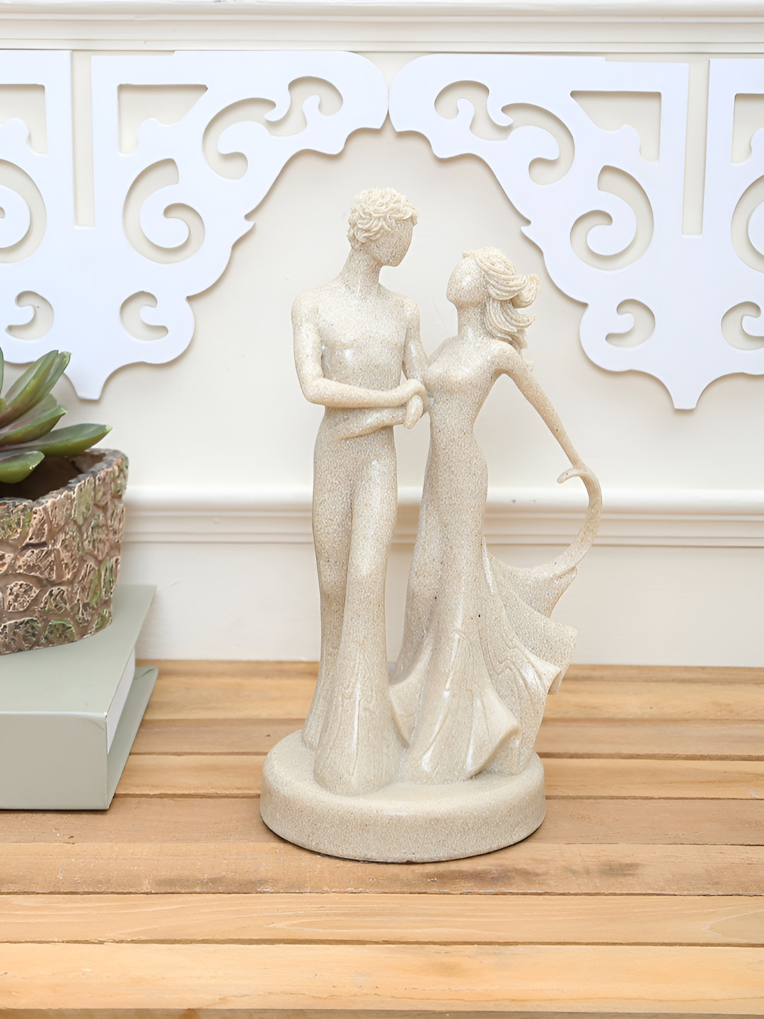 

Myntra Elegant Homes Beige Dreamy Couple Strolling Figurine Resin Showpiece