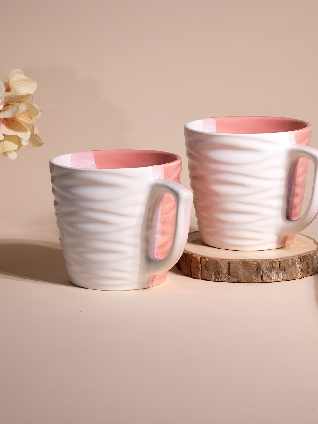 

Storepedia White & Peach-Coloured 2 Pieces Textured Ceramic Glossy Cups 150 ml Each