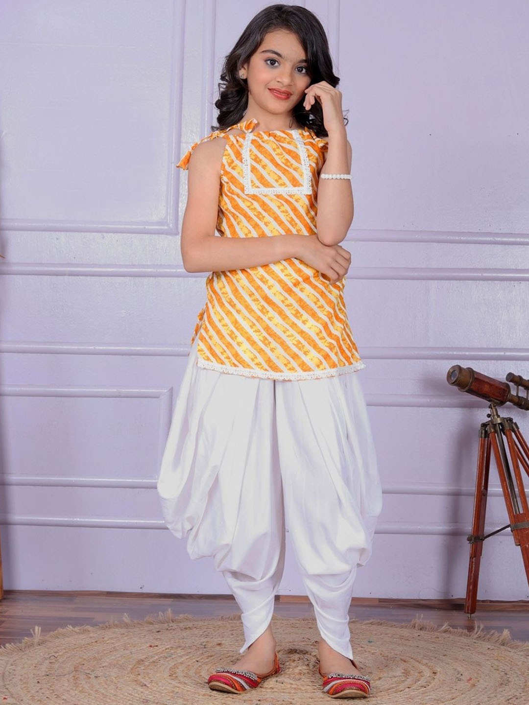 

Anneca Girls Leheriya Printed Shoulder Straps Kurti with Dhoti Pants, Yellow