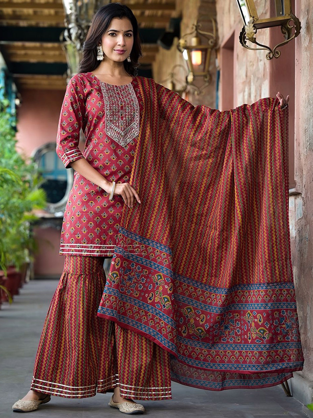 

KALINI Floral Printed Zari Work Pure Cotton Straight Kurta With Sharara And Dupatta, Rust