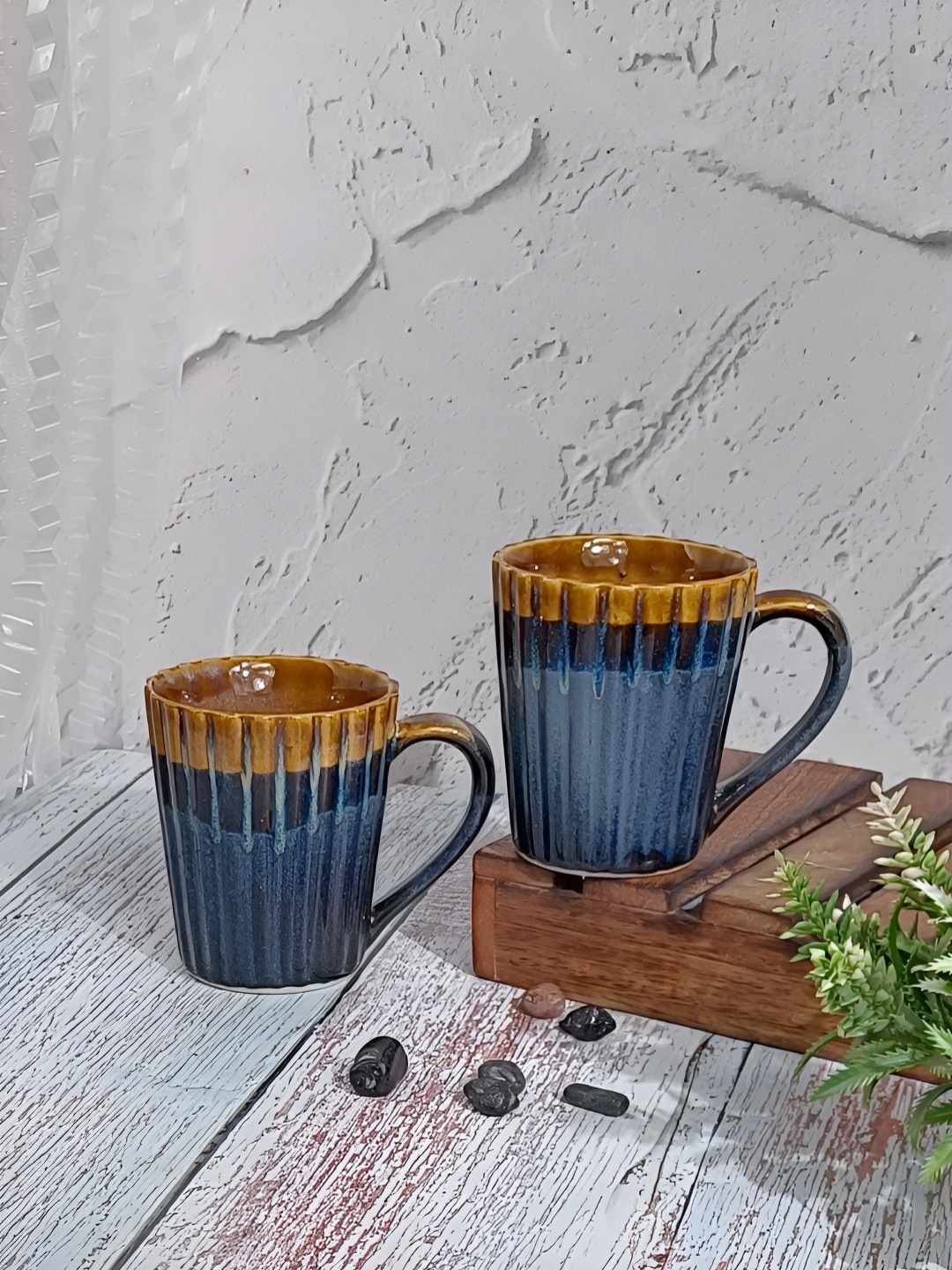 

Myntra Elegant Homes Blue 2 Pieces Striped Ceramic Printed Taper Coffee Mugs - 325 ml