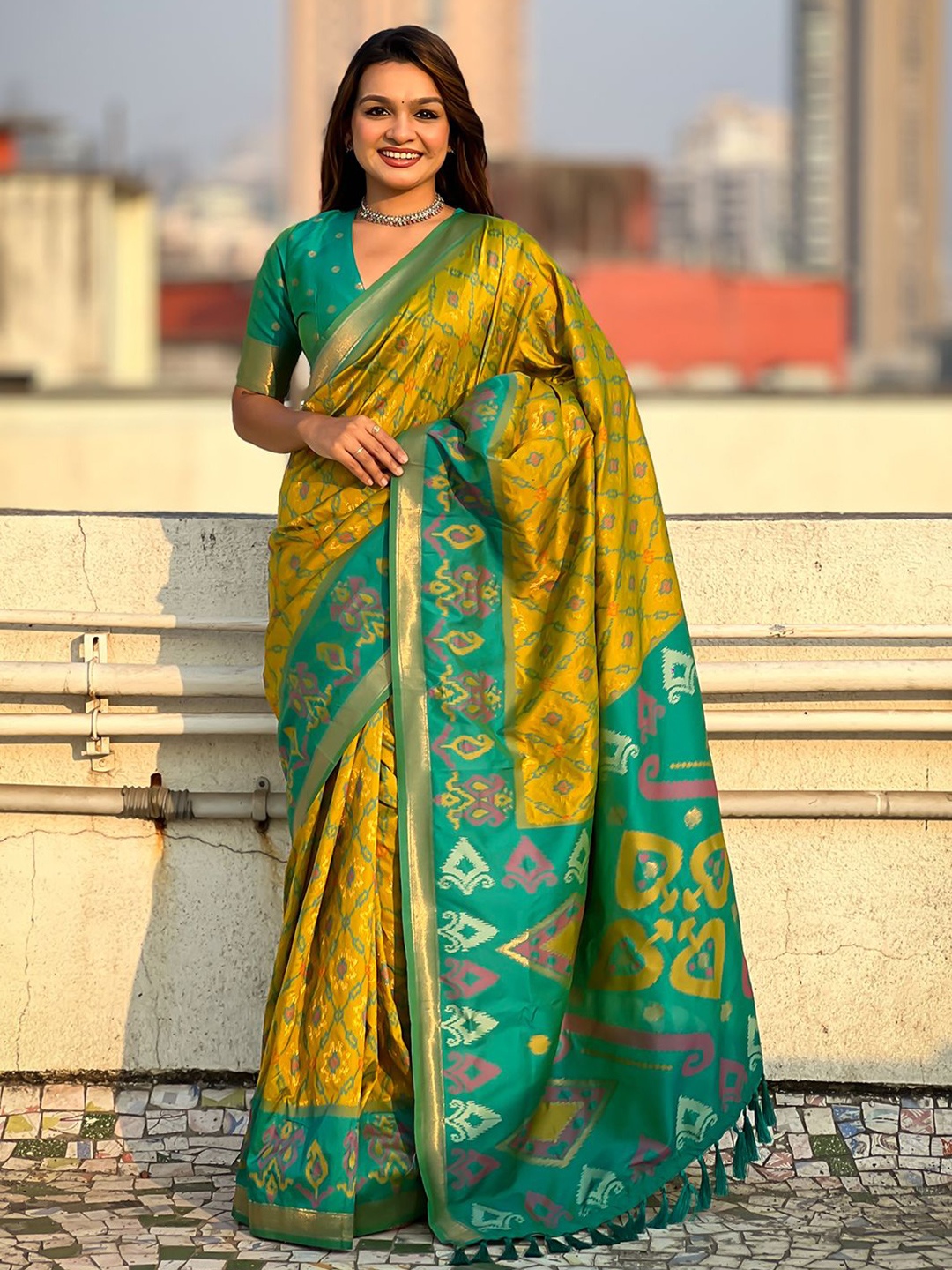 

Mitera Woven Design Zari Patola Saree, Green