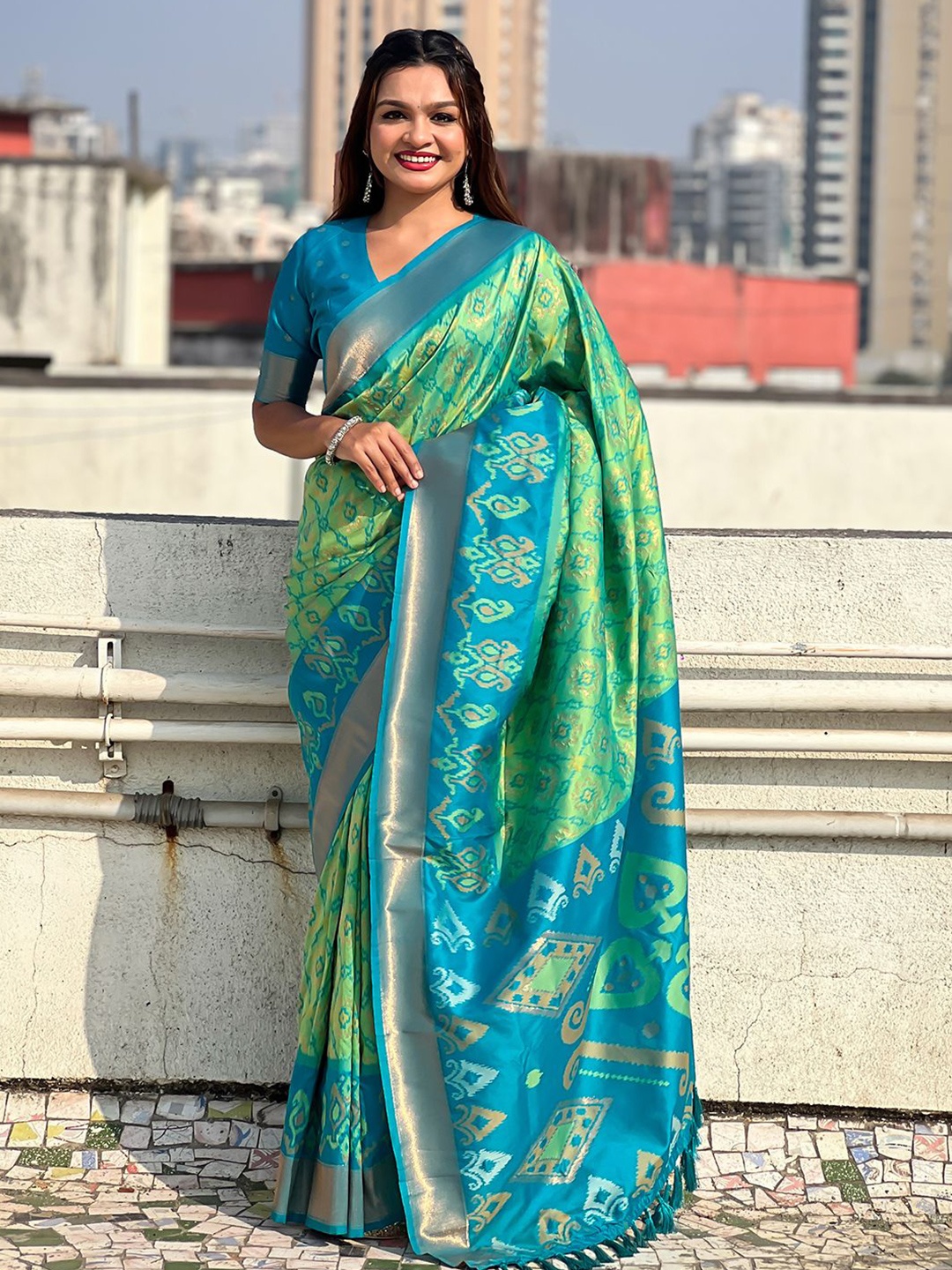 

Mitera Woven Design Zari Patola Saree, Green