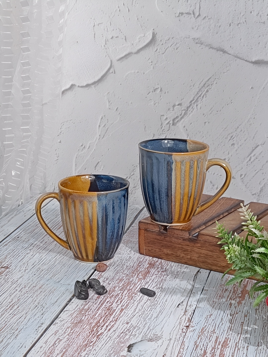 

Myntra Elegant Homes Blue 2 Pieces Colourblocked Glossy Ceramic Coffee Mugs 325 ml Each