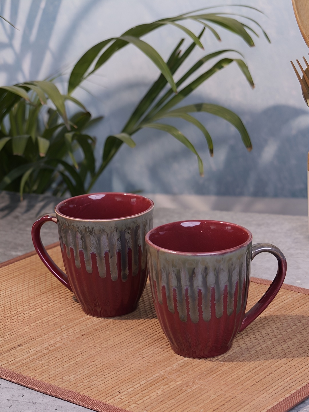 

Myntra Elegant Homes Maroon & Grey 2 Pieces Printed Ceramic Coffee Mugs - 325ml Each