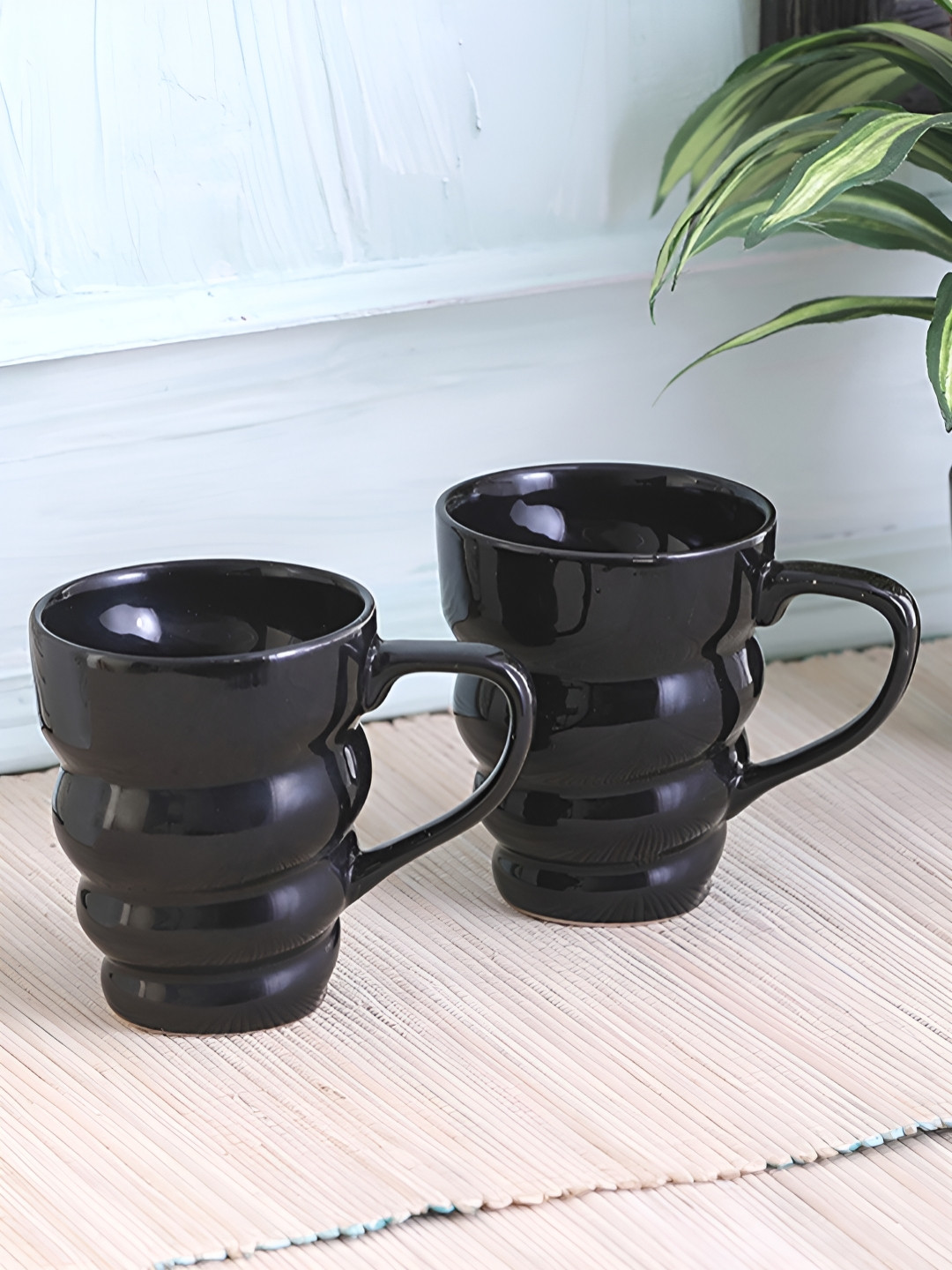 

Myntra Elegant Homes Black 2 Pieces Glossy Microwave Safe Mugs - 200 ml Each