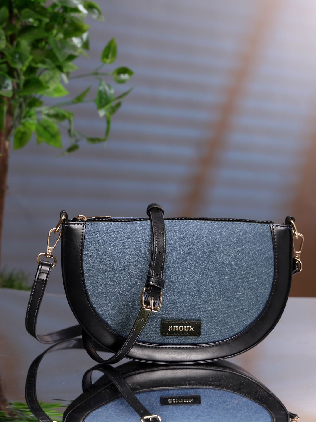

Anouk Women Textured Half Moon Sling Bag, Black
