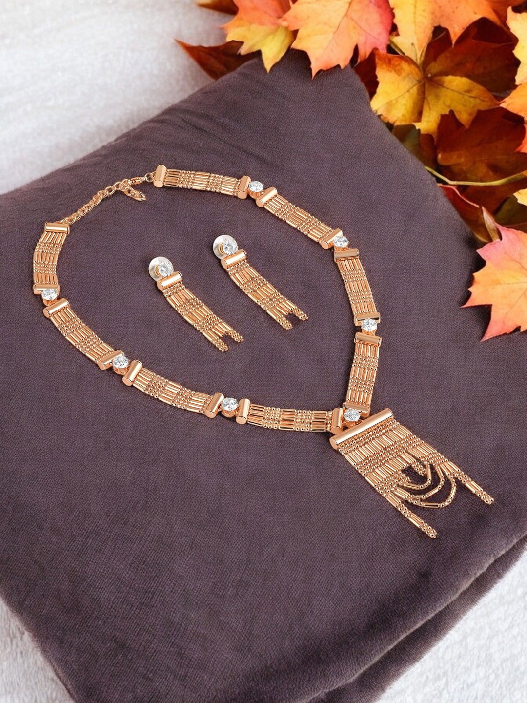 

Mahi Rose Gold-Plated Artificial Stones Studded Tasselled Jewellery Set