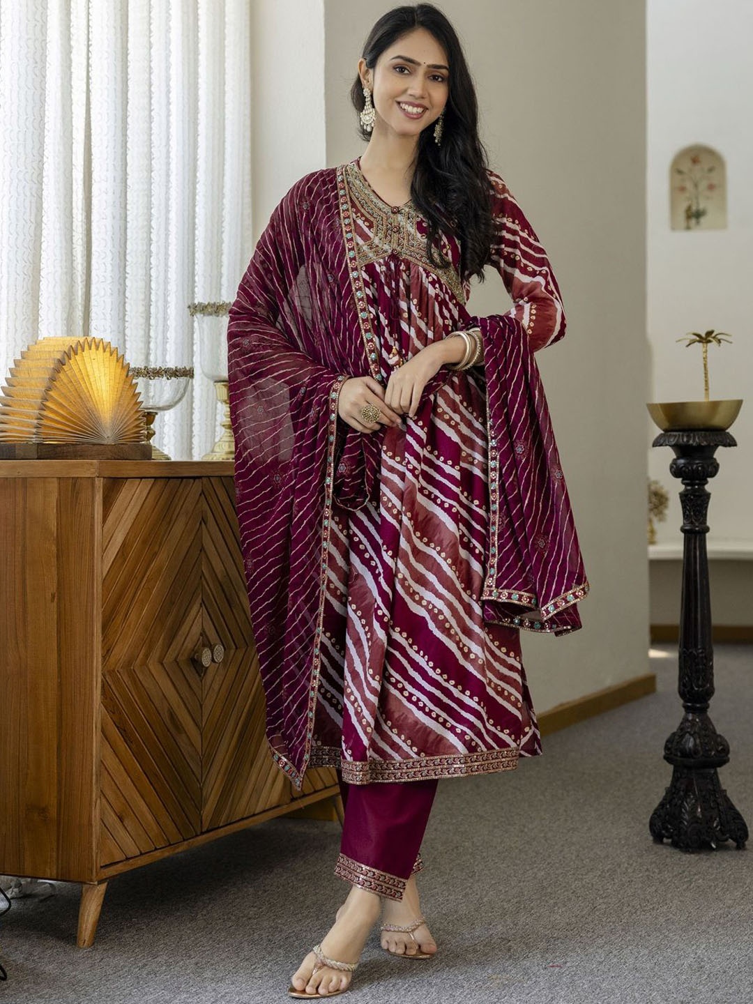 

Gauric creation Leheriya Printed A-Line Kurta With Trousers & Dupatta, Maroon