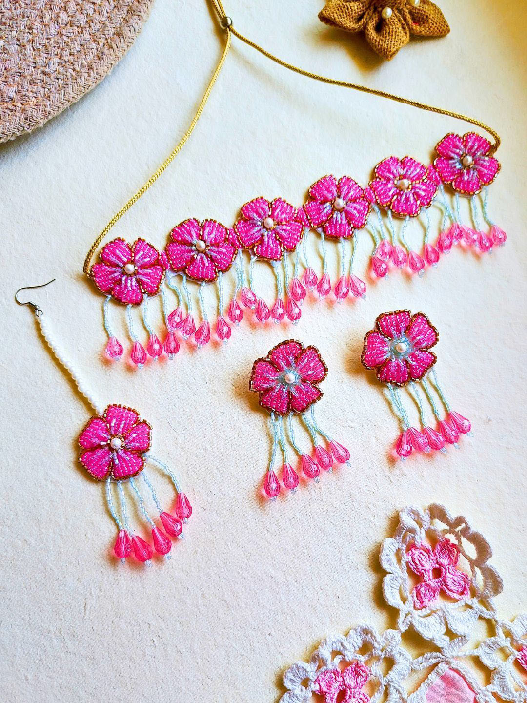 

Sangria Pink Gold-Plated Artificial Beaded Floral Boho Bridal Tasseled Jewellery Set