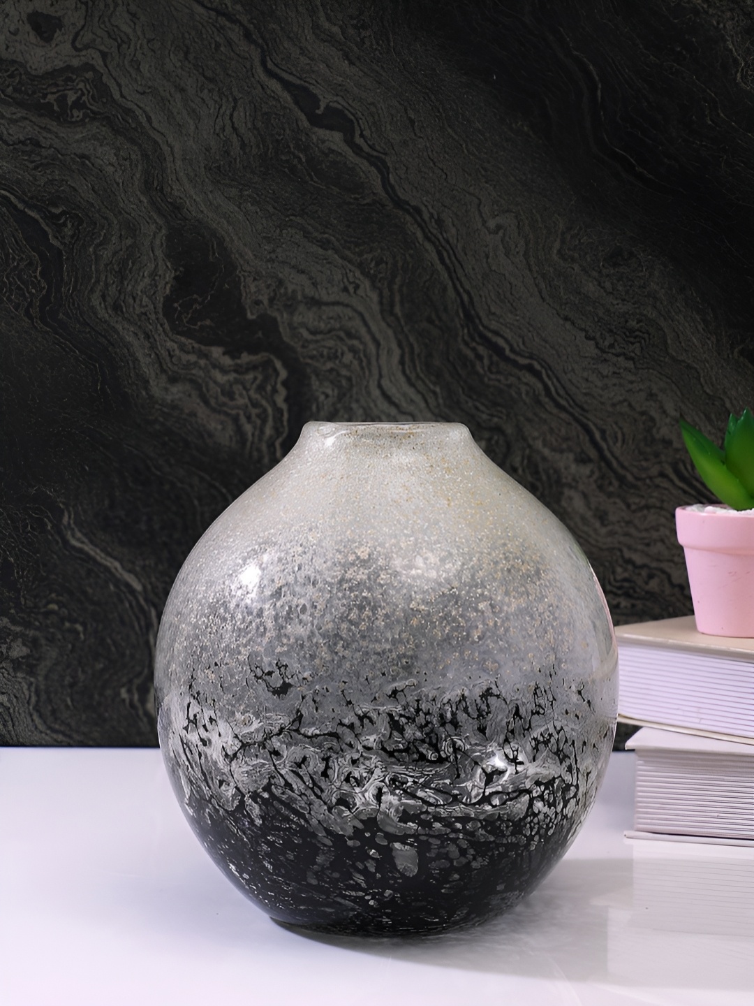 

Myntra Elegant Homes Globe Black & White Textured Glass Flower Vase