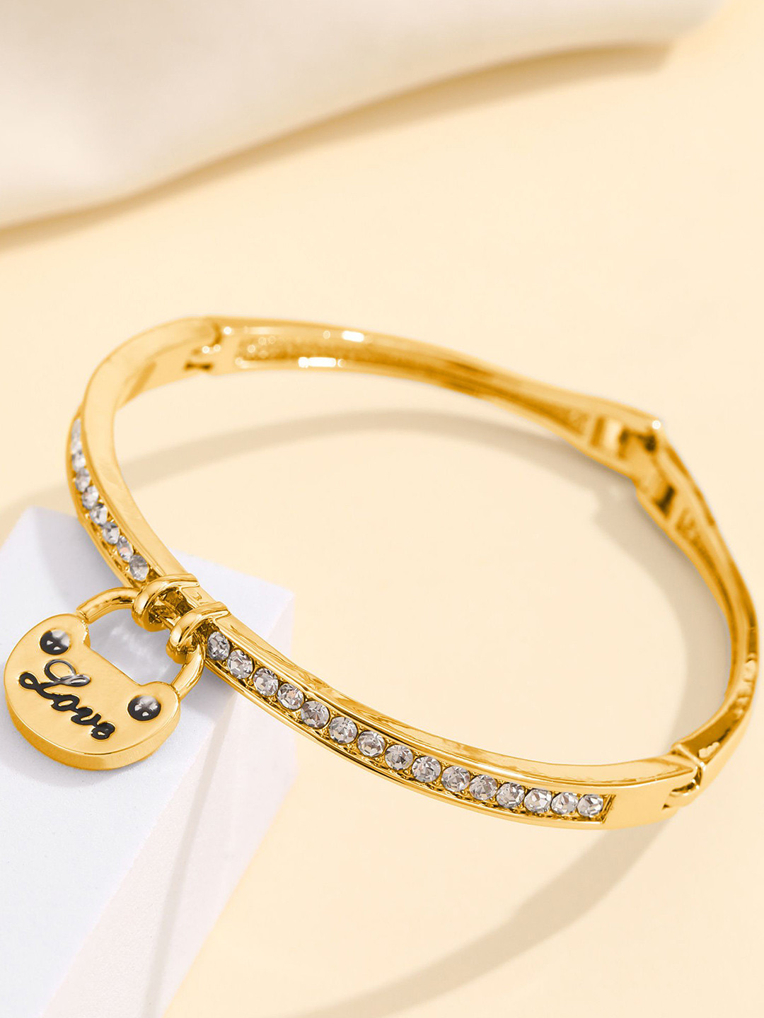 

Shining Diva Fashion Gold-Plated Crystals And Stones Studded Bangle-Style Bracelet