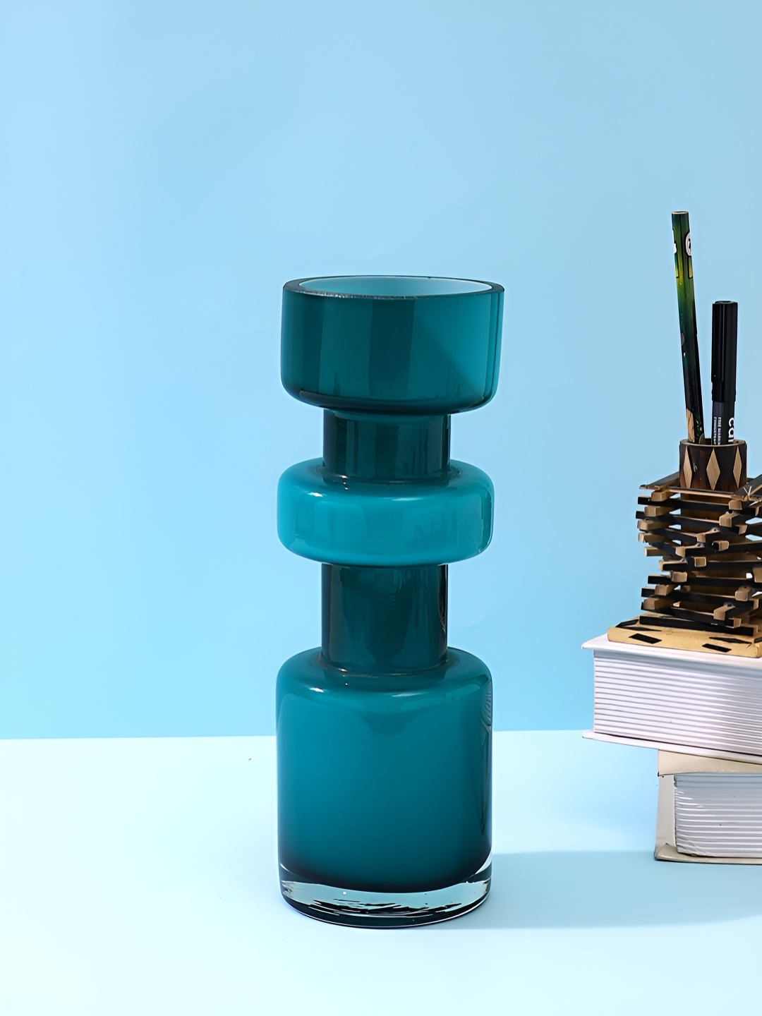 

Myntra Elegant Homes Modern Teal Glass Flower Vase