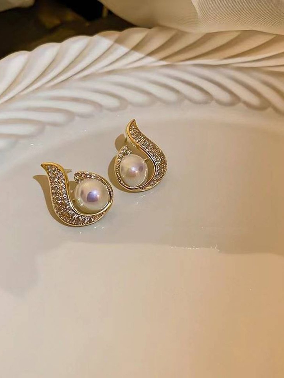 

Celestique Pearls And Artificial Stones Studded Contemporary Shaped Studs, Gold