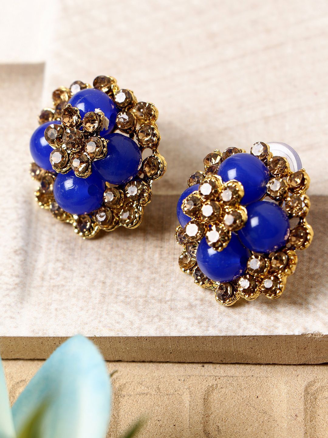 

Anouk Gold-Plated Artificial Stones Studded Floral Shaped Studs