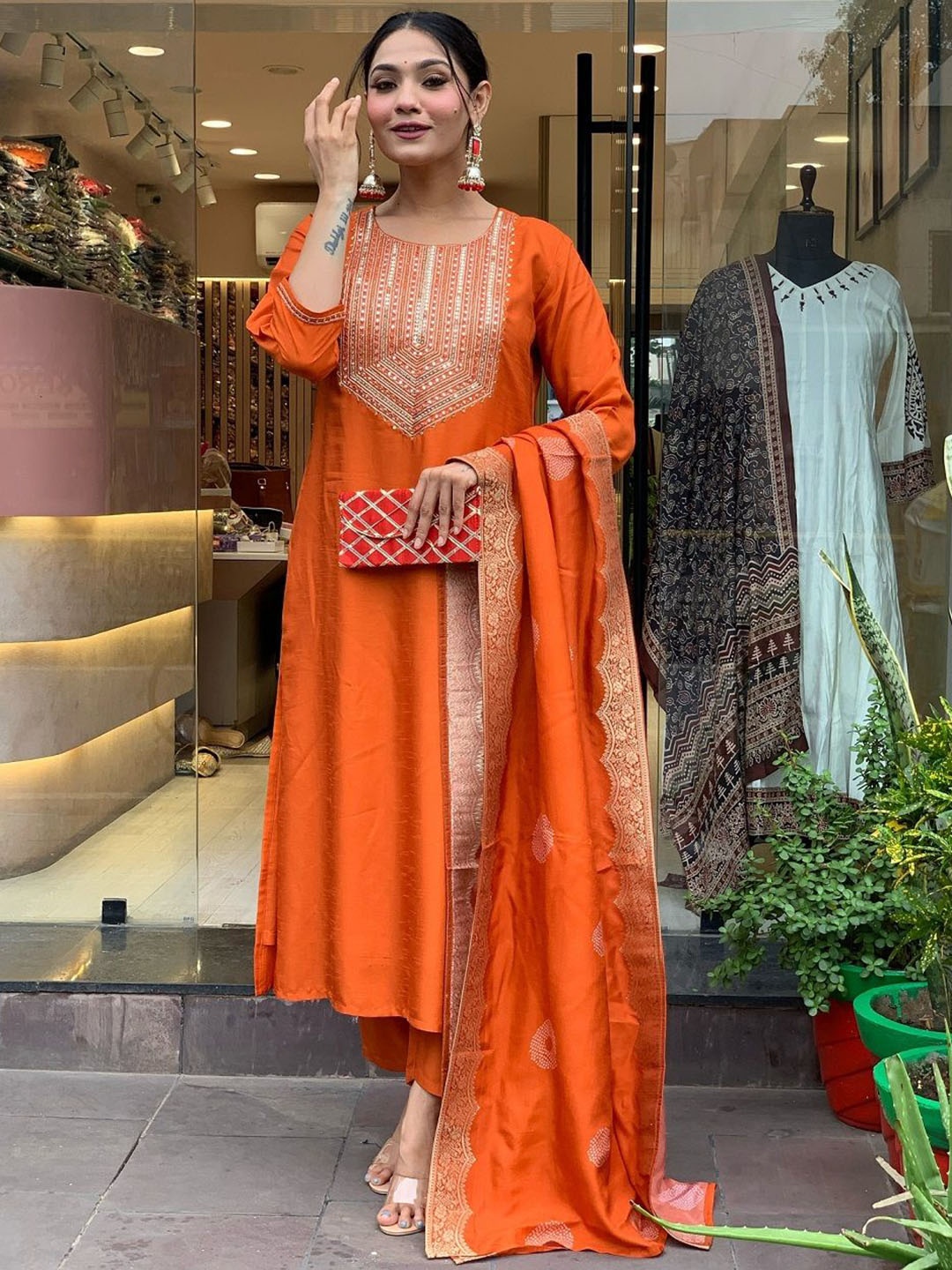 

KAUTIK FABRICS Floral Embroidered Chanderi Silk Kurta With Trousers And Dupatta, Orange