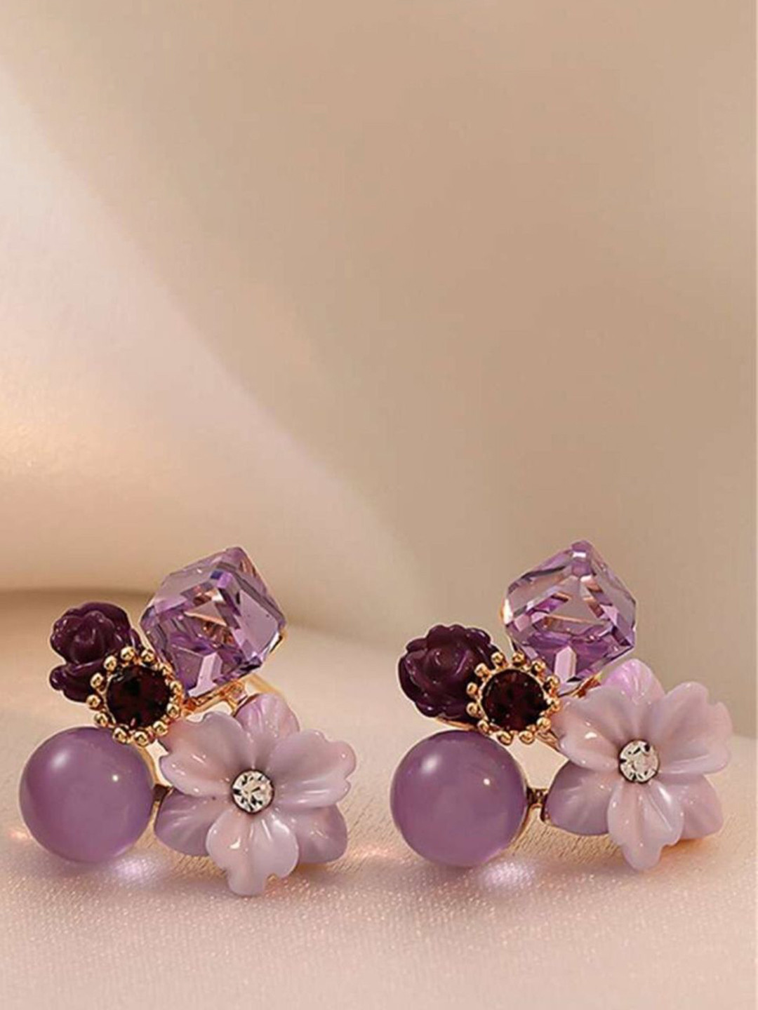 

Celestique Artificial Stone Studded Floral Studs, Purple
