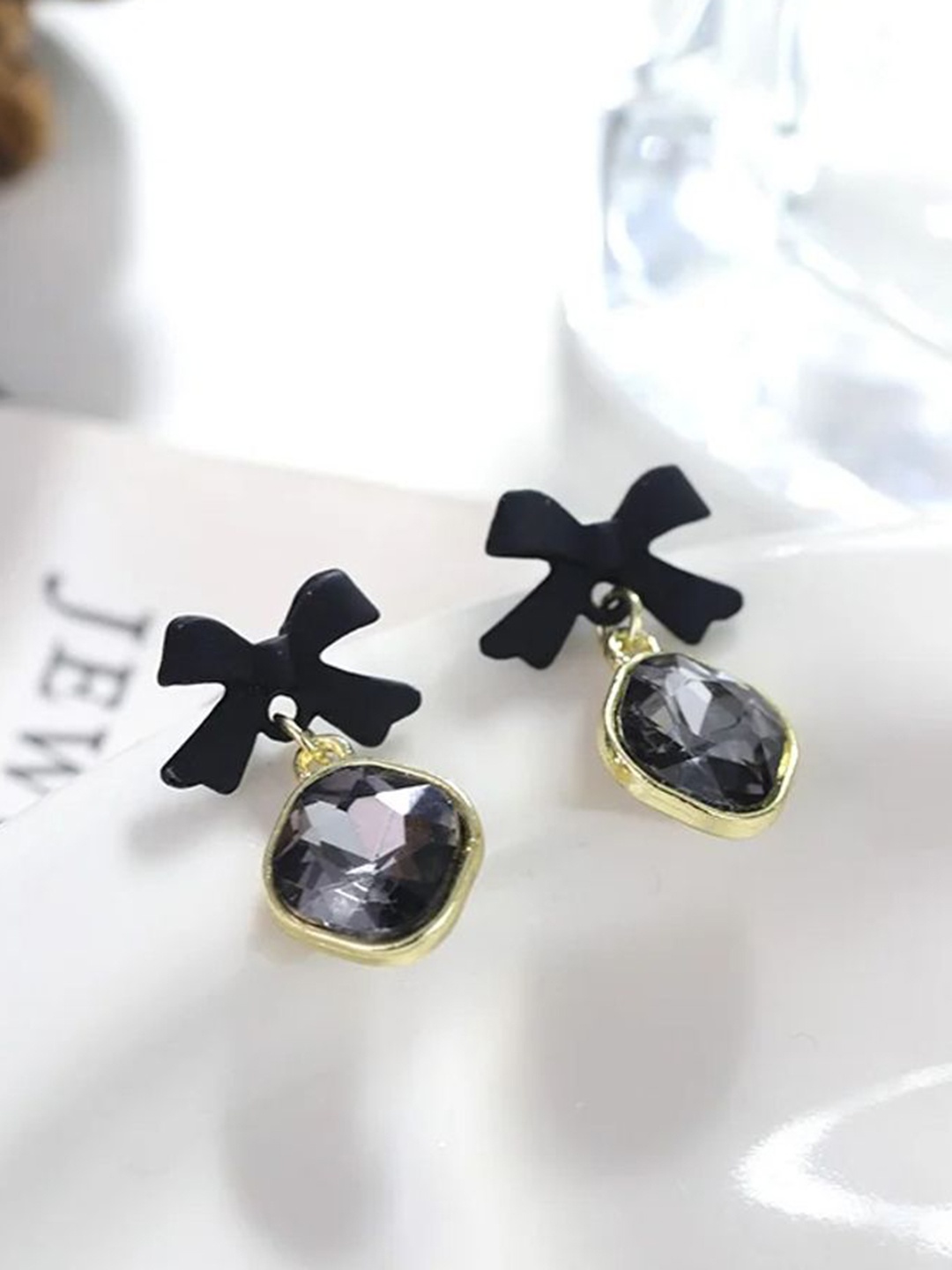 

Celestique Korean Crystals Studded Bow Shaped Drop Earrings, Black