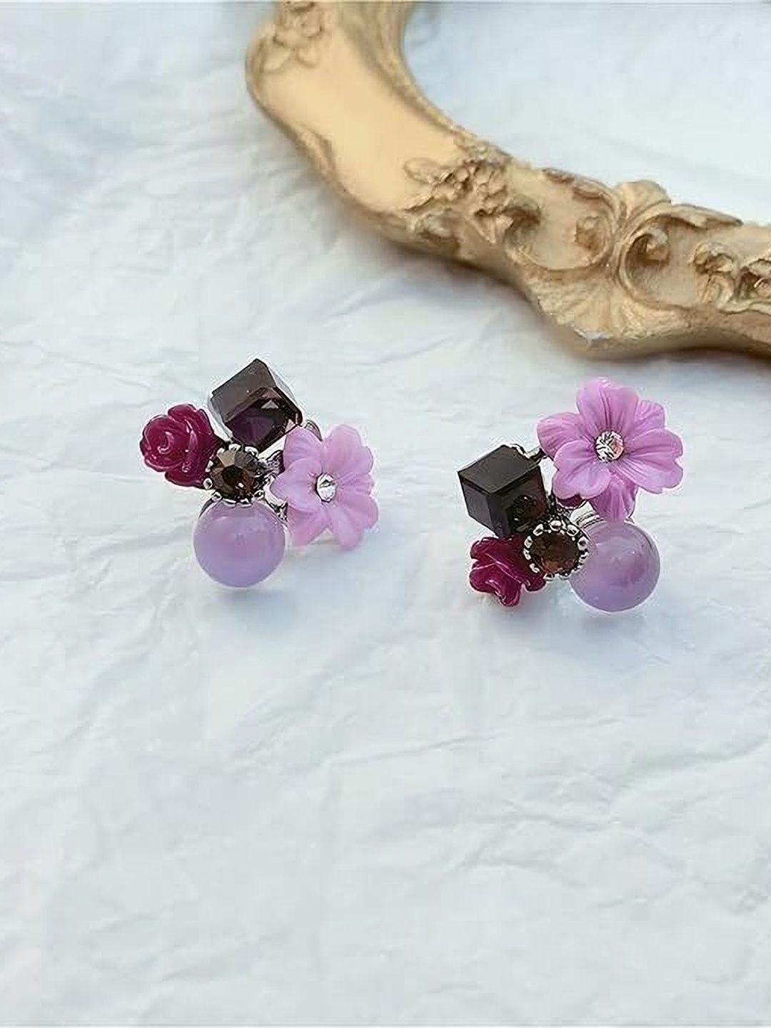

Celestique Artificial Stones Studded Flower Shaped Korean Studs, Purple