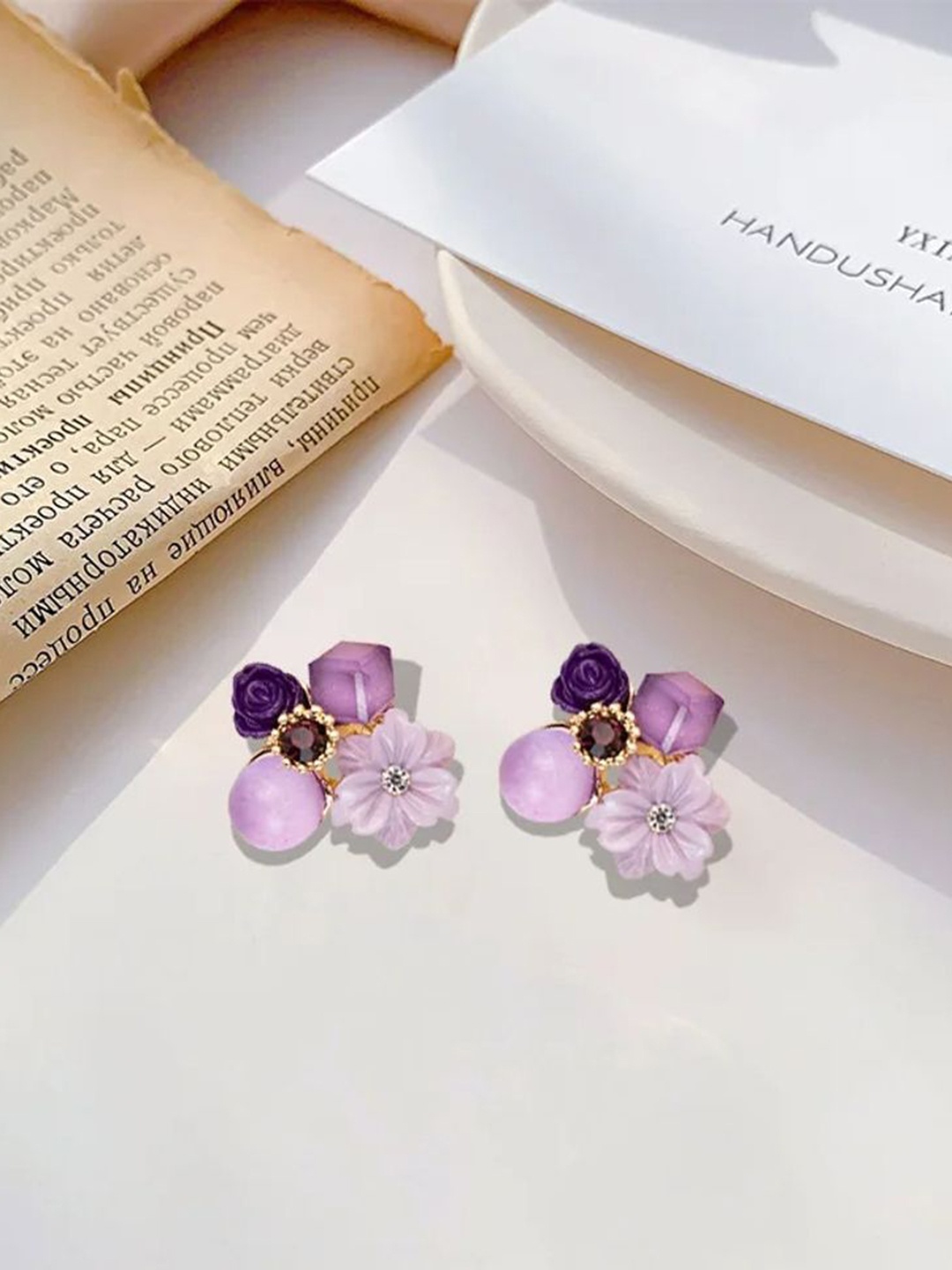 

Celestique Korean Artificial Stones Studded Floral Shaped Studs, Purple
