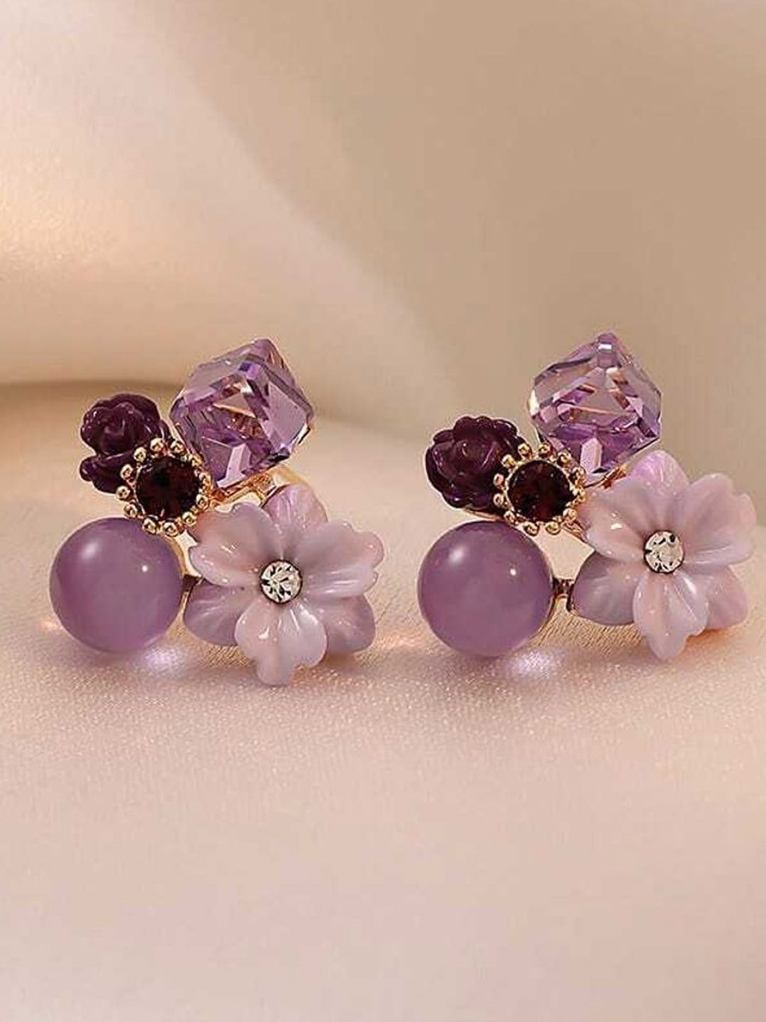 

Celestique Artificial Stones Studded Contemporary Shaped Studs, Purple