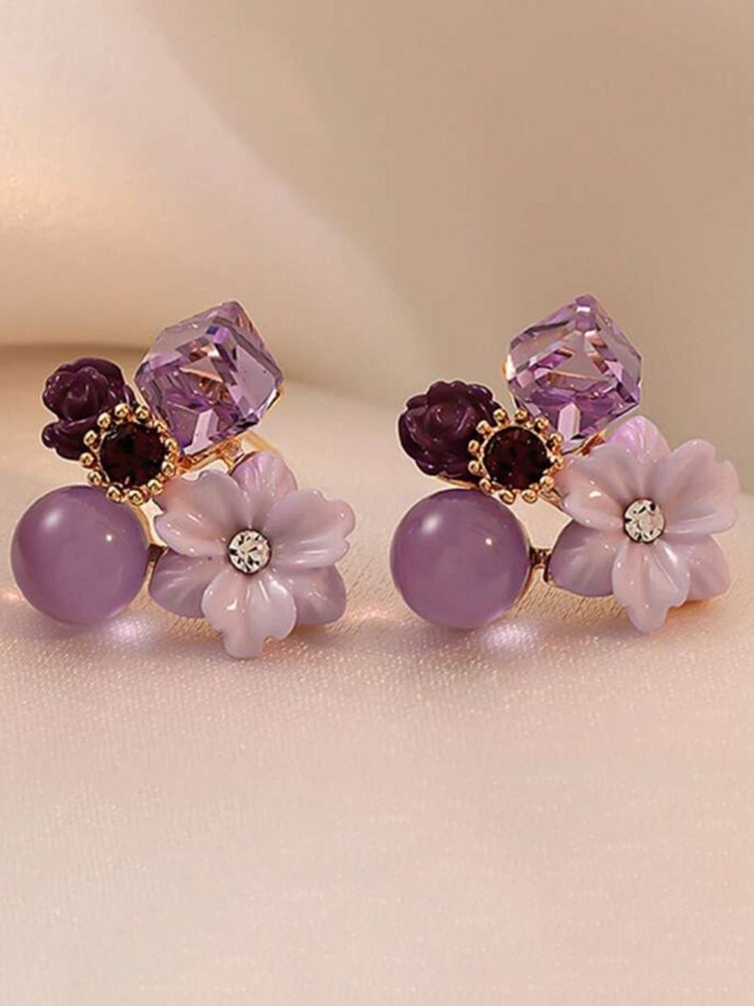 

Celestique Korean Artificial Stones Studded Floral Shaped Studs, Purple