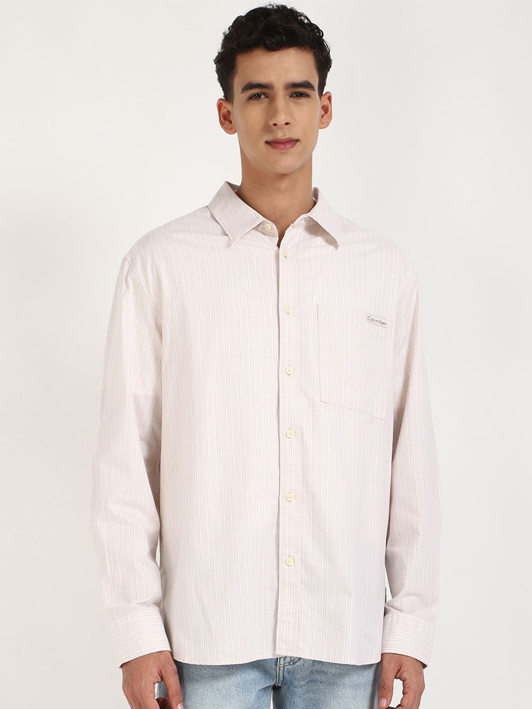 

Calvin Klein Jeans Men Relaxed Fit Spread Collar Vertical Striped Cotton Casual Shirt, Off white