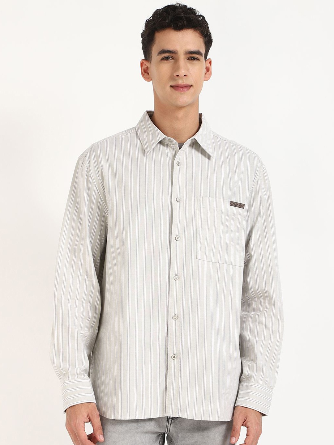 

Calvin Klein Jeans Men Relaxed Fit Spread Collar Vertical Striped Cotton Casual Shirt, Beige