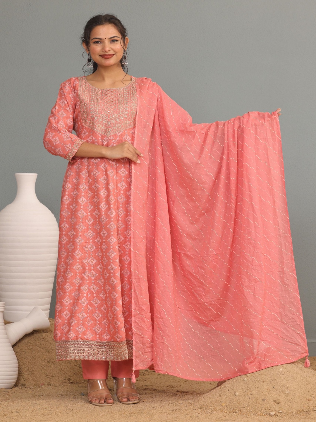 

KALINI Floral Printed And Embroidered Round Neck Anarkali Kurta With Trouser & Dupatta, Peach