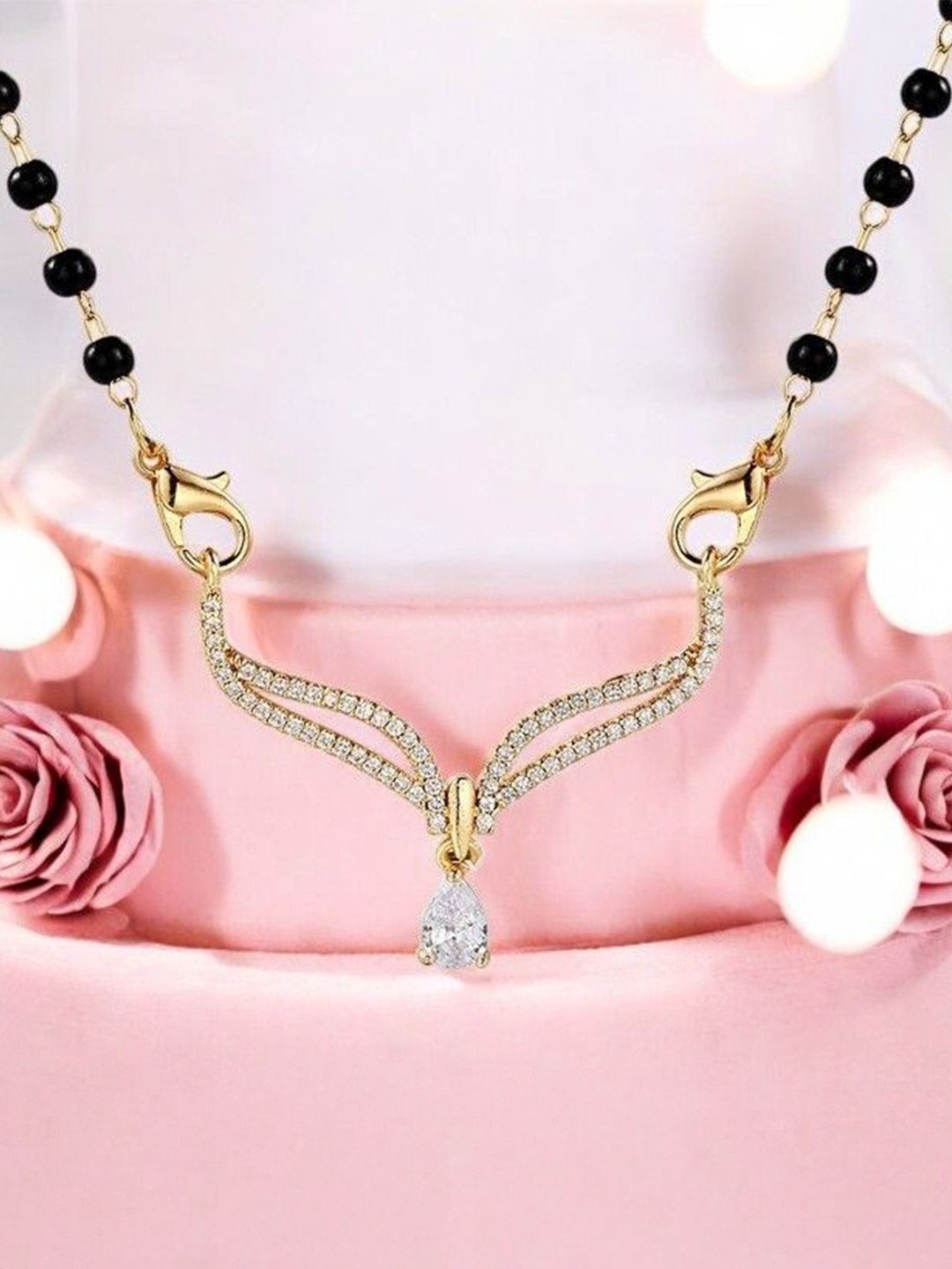 

Nilu's Collection Gold-Plated Embedded With American Diamond Stones & Beaded Mangalsutra