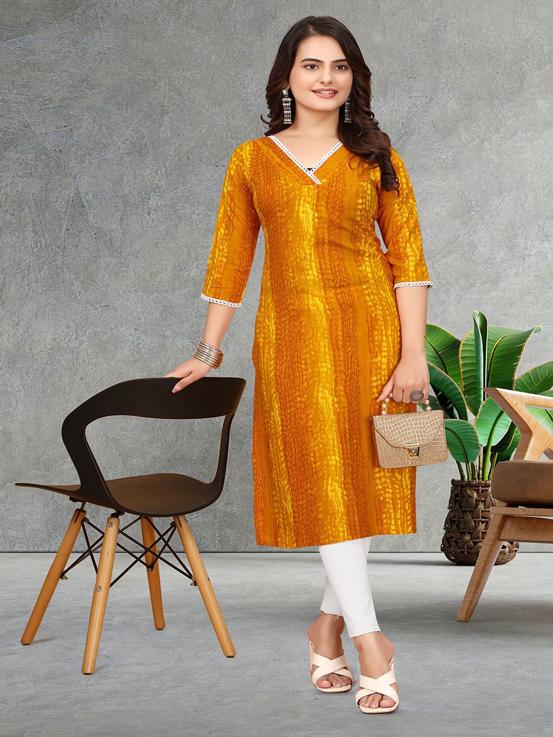 

PATDOM Women Abstract Printed V-Neck Straight Kurta, Mustard