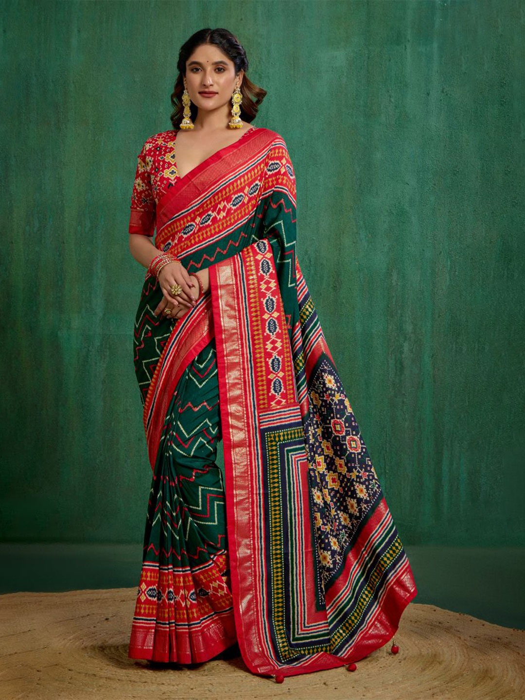 

Sangria Green Velvet Tusser silk Patola Print Ready to Wear Saree