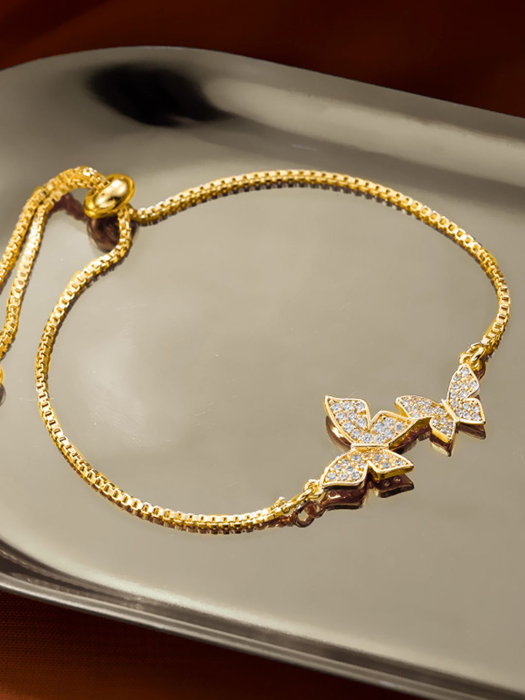 

Peora Gold-Plated Cubic Zirconia Studded Butterfly Shaped Wraparound Bracelet